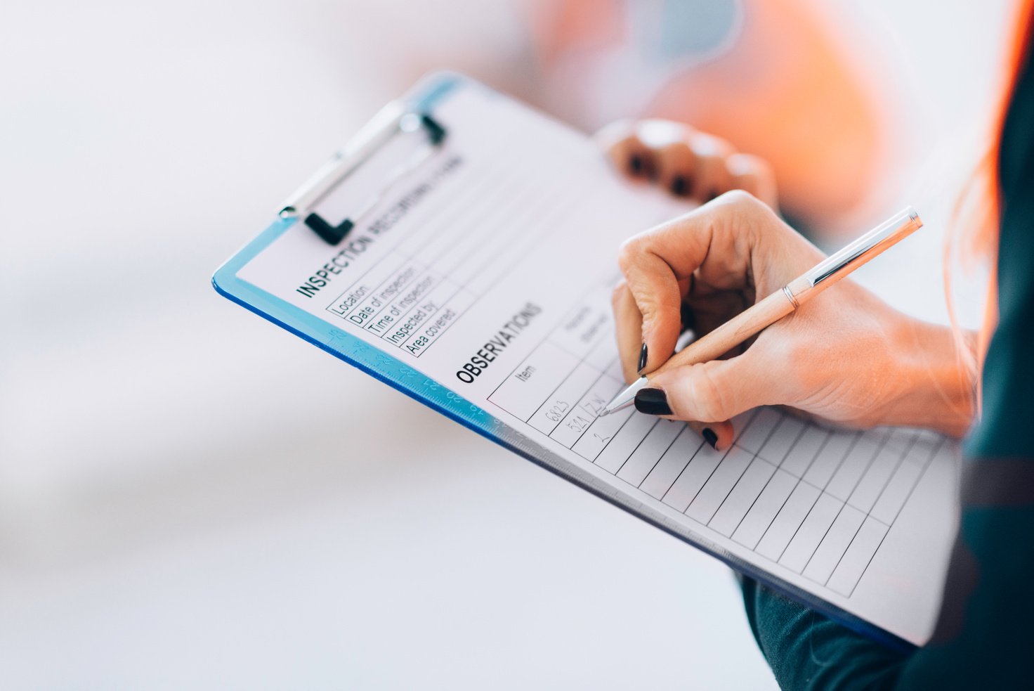 Facility management technician filling inspection form
